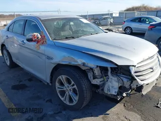2013 Ford Taurus SEL with VIN 1FAHP2E83DG224780, listed as a IAAI auction lot 41675601 with 166,977 mi miles. Bid and sale history available at carsss.com. Image 1.