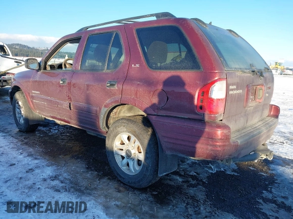 2002 Isuzu Rodeo z VIN 4S2DM58W124319936, wystawiony jako IAAI lot #41555285 z przebiegiem 143 035 mil mil oraz . Historia ofert i sprzedaży dostępna na DreamBid. Obrazek 3.