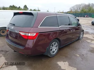 2011 Honda Odyssey EX-L with VIN 5FNRL5H64BB059576, listed as a IAAI auction lot 41903160 with 150,000 mi miles and . Bid and sale history available at carsss.com. Image 4.