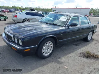 2000 Jaguar XJ with VIN SAJDA14C1YLF04600, listed as a IAAI auction lot 41496106 with 105,000 mi miles. Bid and sale history available at carsss.com. Image 2.