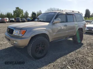 1999 Toyota Land Cruiser z VIN JT3HT05J0X0039052, wystawiony jako Copart lot #54229355 z przebiegiem 228 216 mil mil oraz Czysty tytuł • Clean title. Historia ofert i sprzedaży dostępna na DreamBid. Obrazek 1.