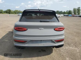 2022 Bentley Bentayga V8 z VIN SJAAM2ZVXNC013736, wystawiony jako Copart lot #67453664 z przebiegiem 22 660 mil mil oraz Nie do naprawy. Historia ofert i sprzedaży dostępna na DreamBid. Obrazek 6.