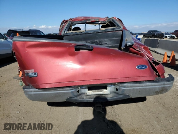 2000 Ford F-150 XL with VIN 1FTZX1728YNA87502, listed as a Copart auction lot 54870295 with 219,971 mi miles and Salvage title. Bid and sale history available at DreamBid. Image 6.