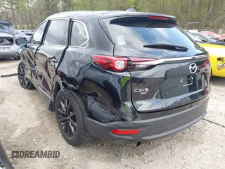 2022 Mazda CX-9 Touring Plus z VIN JM3TCBAYXN0613830, wystawiony jako IAAI lot #41942849 z przebiegiem 50 193 mil mil oraz . Historia ofert i sprzedaży dostępna na DreamBid. Obrazek 3.