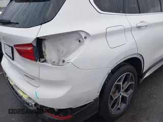 2019 BMW X1 xDrive28i with VIN WBXHT3C54K3H35641, listed as a IAAI auction lot 42241894 with 100,989 mi miles and . Bid and sale history available at DreamBid. Image 18.