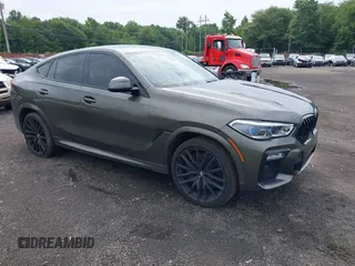 2021 BMW X6 M50i with VIN 5UXCY8C03M9D80163, listed as a IAAI auction lot 39885522 with 48,533 mi miles. Bid and sale history available at carsss.com. Image 1.