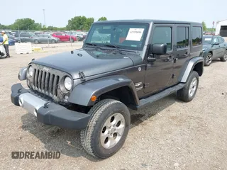 2014 Jeep Wrangler Unlimited Sahara with VIN 1C4BJWEG8EL285843, listed as a IAAI auction lot 42399090 with Not provided miles and . Bid and sale history available at DreamBid. Image 2.