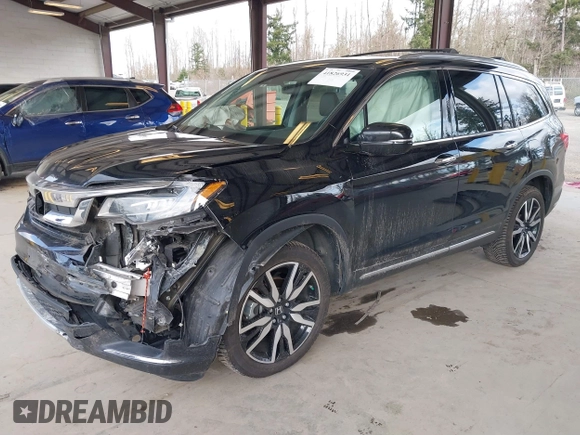 2021 Honda Pilot Elite with VIN 5FNYF6H04MB043014, listed as a IAAI auction lot 41826931 with 63,546 mi miles and . Bid and sale history available at DreamBid. Image 17.
