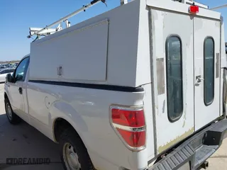 2014 Ford F-150 XL with VIN 1FTMF1CM4EKG22844, listed as a IAAI auction lot 41669259 with 242,141 mi miles. Bid and sale history available at carsss.com. Image 3.