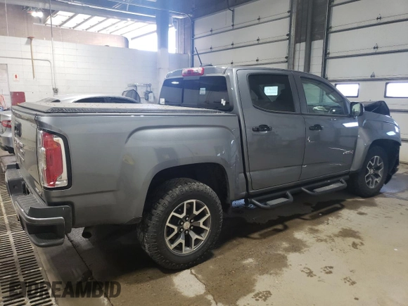 2021 GMC Canyon 4WD AT4 z VIN 1GTG6FEN1M1203936, wystawiony jako Copart lot #56041315 z przebiegiem 54 939 mil mil oraz Szkoda całkowita • Salvage title. Historia ofert i sprzedaży dostępna na DreamBid. Obrazek 3.