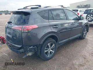 2018 Toyota RAV4 XLE with VIN 2T3WFREV4JW417555, listed as a IAAI auction lot 41092589 with 93,788 mi miles and . Bid and sale history available at DreamBid. Image 4.