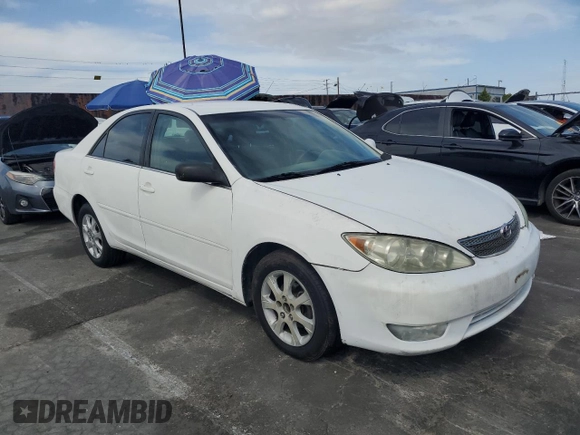 2004 Toyota Camry LE with VIN 4T1BE32KX4U379593, listed as a Copart auction lot 53391455 with 221,056 mi miles and Salvage Title. Bid and sale history available at carsss.com. Image 4.