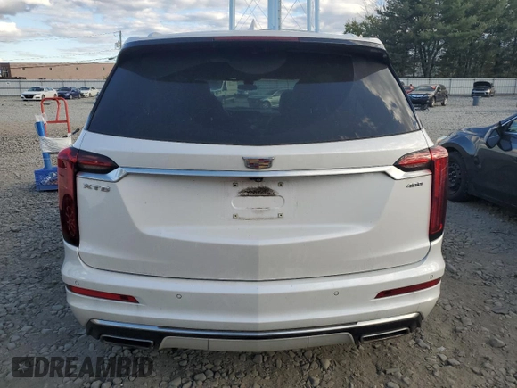 2020 Cadillac XT6 FWD Premium Luxury with VIN 1GYKPCRS2LZ138465, listed as a Copart auction lot 76114034 with 57,353 mi miles and Salvage Title. Bid and sale history available at carsss.com. Image 6.