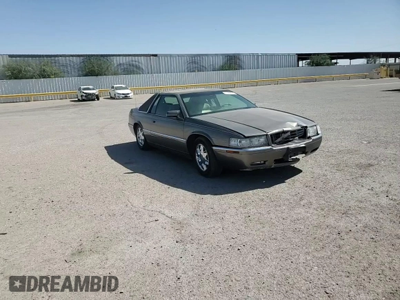1998 Cadillac Eldorado z VIN 1G6EL12YXWU610918, wystawiony jako Copart lot #57309075 z przebiegiem 168 228 mil mil oraz Szkoda całkowita • Salvage title. Historia ofert i sprzedaży dostępna na DreamBid. Obrazek 13.