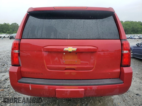 2015 Chevrolet Suburban LT with VIN 1GNSCJKC2FR306223, listed as a Copart auction lot 58733475 with 191,330 mi miles and Salvage title. Bid and sale history available at DreamBid. Image 6.