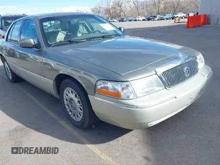 2004 Mercury Grand Marquis GS z VIN 2MEFM74W74X678515, wystawiony jako IAAI lot #41916962 z przebiegiem 121 789 mil mil oraz . Historia ofert i sprzedaży dostępna na DreamBid. Obrazek 1.