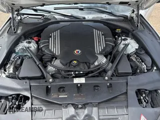 2015 BMW 6 Series 650i xDrive with VIN WBA6B4C57FD899926, listed as a Copart auction lot 54974505 with 63,570 mi miles and Salvage Title. Bid and sale history available at carsss.com. Image 7.