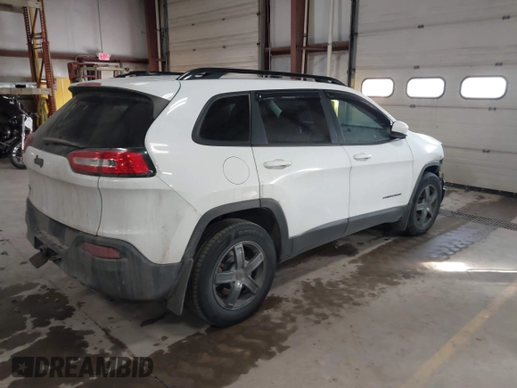 2014 Jeep Cherokee Latitude with VIN 1C4PJMCS5EW288909, listed as a IAAI auction lot 41531117 with 108,971 mi miles and . Bid and sale history available at DreamBid. Image 4.