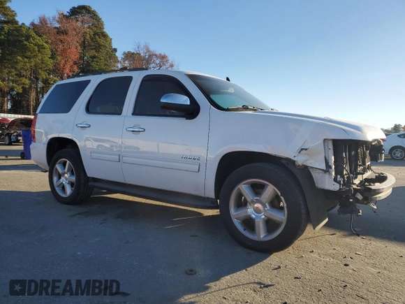 2013 Chevrolet Tahoe LS with VIN 1GNSCAE09DR340125, listed as a Copart auction lot 82894734 with 214,909 mi miles and Salvage title. Bid and sale history available at DreamBid. Image 4.