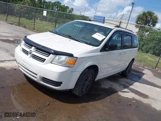 2010 Dodge Grand Caravan SE with VIN 2D4RN4DE5AR490306, listed as a IAAI auction lot 41944376 with 127,107 mi miles. Bid and sale history available at carsss.com. Image 2.