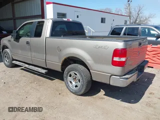 2005 Ford F-150 XLT with VIN 1FTPX14525NA78019, listed as a IAAI auction lot 41932381 with 170,153 mi miles. Bid and sale history available at carsss.com. Image 3.