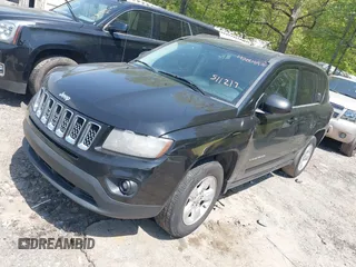 2014 Jeep Compass Sport with VIN 1C4NJCBA0ED511217, listed as a IAAI auction lot 42008976 with 210,780 mi miles. Bid and sale history available at carsss.com. Image 2.