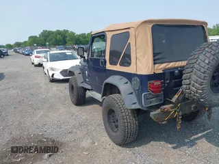 2006 Jeep Wrangler Sport z VIN 1J4FA49S66P708332, wystawiony jako IAAI lot #42402995 z przebiegiem 130 795 mil mil oraz . Historia ofert i sprzedaży dostępna na DreamBid. Obrazek 3.