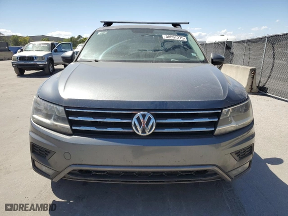 2018 Volkswagen Tiguan S with VIN 3VV1B7AX4JM037328, listed as a Copart auction lot 50067275 with 213,669 mi miles and Clean Title. Bid and sale history available at carsss.com. Image 5.