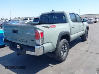 2023 Toyota Tacoma SR with VIN 3TMCZ5AN3PM590101, listed as a IAAI auction lot 42338670 with 12,970 mi miles and . Bid and sale history available at DreamBid. Image 4.
