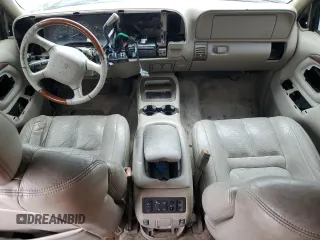 1999 Cadillac Escalade z VIN 1GYEK13R5XR415895, wystawiony jako Copart lot #87112044 z przebiegiem 141 662 mil mil oraz Tytuł czysty. Historia ofert i sprzedaży dostępna na DreamBid. Obrazek 8.