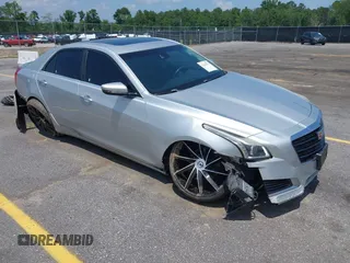 2015 Cadillac CTS Luxury AWD with VIN 1G6AX5SXXF0110590, listed as a IAAI auction lot 42437971 with 88,288 mi miles and . Bid and sale history available at DreamBid. Image 1.