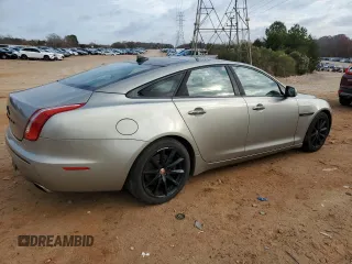 2014 Jaguar XJ with VIN SAJWA1CZ5E8V71971, listed as a Copart auction lot 82116114 with 127,164 mi miles and Salvage Title. Bid and sale history available at DreamBid. Image 3.