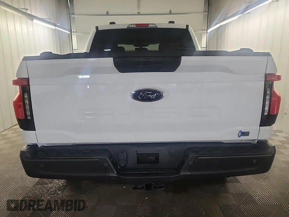 2023 Ford F-150 Lightning Pro z VIN 1FTVW1EL0PWG02840, wystawiony jako IAAI lot #42379448 z przebiegiem 52 710 mil mil oraz . Historia ofert i sprzedaży dostępna na DreamBid. Obrazek 3.