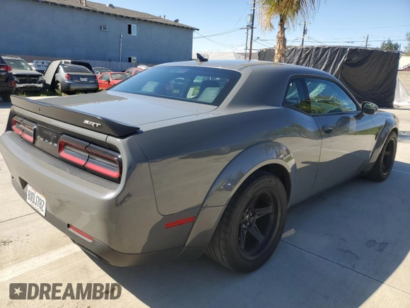 2018 Dodge Challenger z VIN 2C3CDZH90JH102960, wystawiony jako Copart lot #49121955 z przebiegiem 39 574 mil mil oraz Czysty tytuł • Clean title. Historia ofert i sprzedaży dostępna na DreamBid. Obrazek 4.