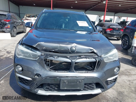 2017 BMW X1 xDrive28i with VIN WBXHT3Z33H4A65198, listed as a IAAI auction lot 41798503 with 88,951 mi miles. Bid and sale history available at carsss.com. Image 6.