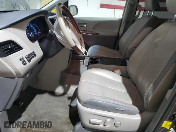 2012 Toyota Sienna XLE с VIN 5TDDK3DC5CS037368, выставлен на аукционе Copart как лот 49626985 с пробегом 164 431 миль миль и Списание • Salvage title. История ставок и продаж доступна на DreamBid. Изображение 7.