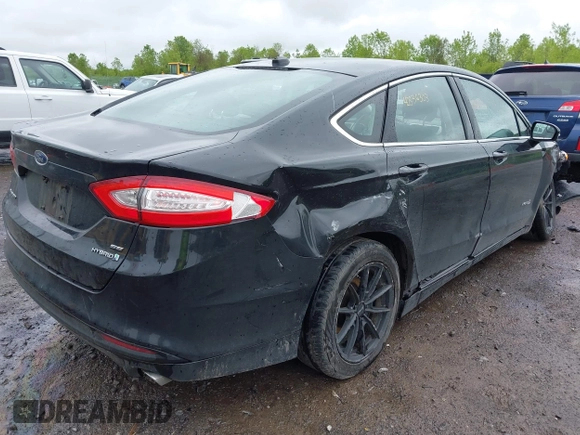 2014 Ford Fusion SE Hybrid with VIN 3FA6P0LU9ER310990, listed as a IAAI auction lot 42336303 with 197,588 mi miles and . Bid and sale history available at DreamBid. Image 4.
