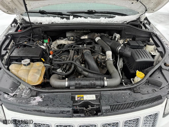2014 Jeep Grand Cherokee Overland with VIN 1C4RJFCM1EC298621, listed as a Copart auction lot 54796775 with 142,491 mi miles and Clean Title. Bid and sale history available at carsss.com. Image 7.