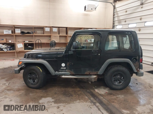 2003 Jeep Wrangler Sport Right Hand Drive with VIN 1J4F449S63P359031, listed as a IAAI auction lot 41495087 with 126,678 mi miles. Bid and sale history available at carsss.com. Image 14.