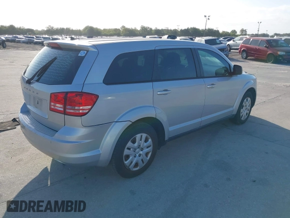 2014 Dodge Journey SE with VIN 3C4PDCAB0ET221998, listed as a IAAI auction lot 40609907 with 203,241 mi miles and . Bid and sale history available at carsss.com. Image 4.