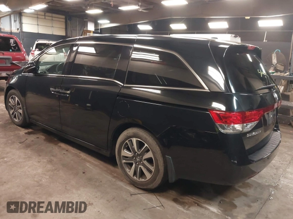 2014 Honda Odyssey Touring with VIN 5FNRL5H94EB105745, listed as a IAAI auction lot 41744012 with 77,032 mi miles and . Bid and sale history available at DreamBid. Image 3.