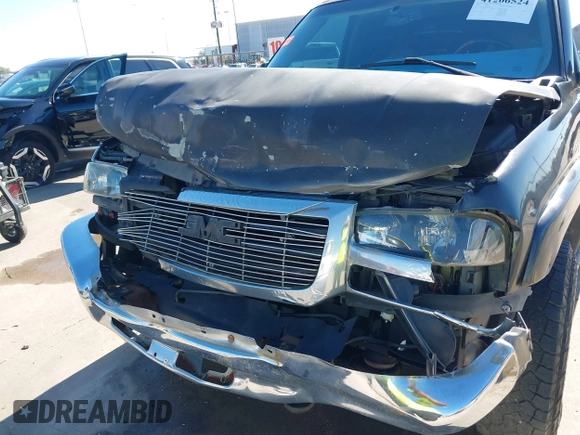 2003 GMC Sierra 1500HD SLE z VIN 1GTGC13U53F203980, wystawiony jako IAAI lot #41206524 z przebiegiem 309 414 mil mil oraz . Historia ofert i sprzedaży dostępna na DreamBid. Obrazek 6.
