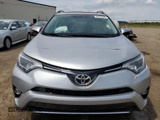 2016 Toyota RAV4 XLE with VIN 2T3RFREV9GW439315, listed as a Copart auction lot 59704345 with 143,198 mi miles and Salvage title. Bid and sale history available at DreamBid. Image 5.