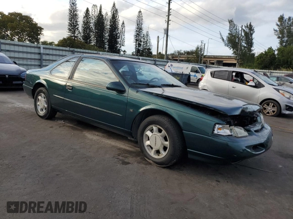 1994 Ford Thunderbird LX with VIN 1FALP62W6RH128762, listed as a Copart auction lot 84306604 with 68,314 mi miles and Salvage Title. Bid and sale history available at DreamBid. Image 4.