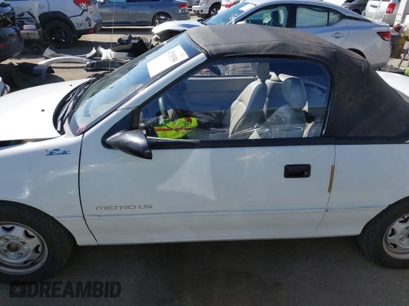 1992 Geo Metro z VIN JG1MR3364NK213871, wystawiony jako IAAI lot #41719350 z przebiegiem 22 589 mil mil oraz . Historia ofert i sprzedaży dostępna na DreamBid. Obrazek 14.