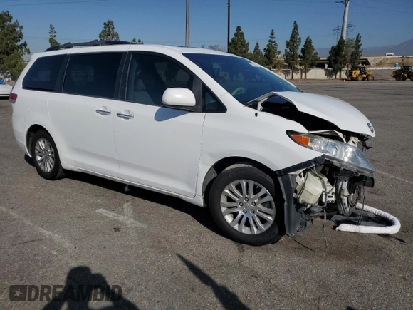 2013 Toyota Sienna XLE AAS with VIN 5TDYK3DC5DS322039, listed as a Copart auction lot 61657715 with 185,269 mi miles and Salvage title. Bid and sale history available at DreamBid. Image 4.