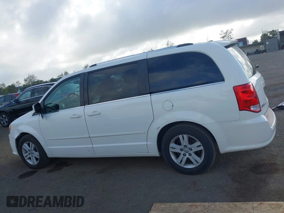 2013 Dodge Grand Caravan Crew with VIN 2C4RDGDG4DR606263, listed as a IAAI auction lot 41898351 with 127,044 mi miles and . Bid and sale history available at DreamBid. Image 14.