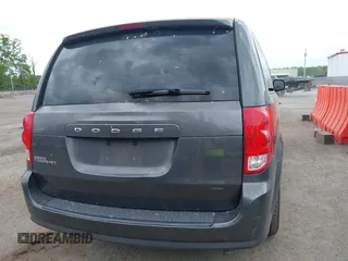 2015 Dodge Grand Caravan American Value with VIN 2C4RDGBG2FR542844, listed as a IAAI auction lot 42109983 with 129,718 mi miles and . Bid and sale history available at DreamBid. Image 16.