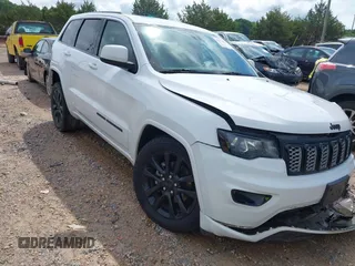 2019 Jeep Grand Cherokee Altitude with VIN 1C4RJEAG7KC533316, listed as a IAAI auction lot 42471064 with 142,299 mi miles and . Bid and sale history available at DreamBid. Image 1.