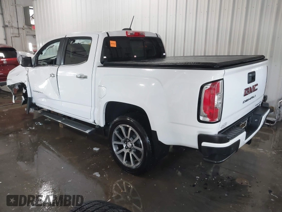 2021 GMC Canyon 4WD Denali with VIN 1GTG6EEN0M1229180, listed as a IAAI auction lot 41298304 with 55,865 mi miles. Bid and sale history available at carsss.com. Image 3.